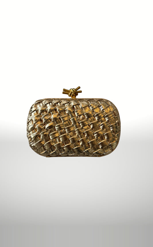 POSH Ateliers woven knot clutch in gold