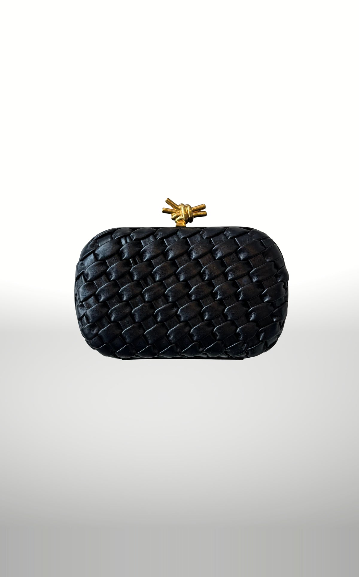 POSH Ateliers woven knot clutch in black with gold knot clasp