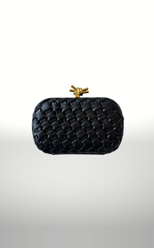 POSH Ateliers woven knot clutch in black with gold knot clasp